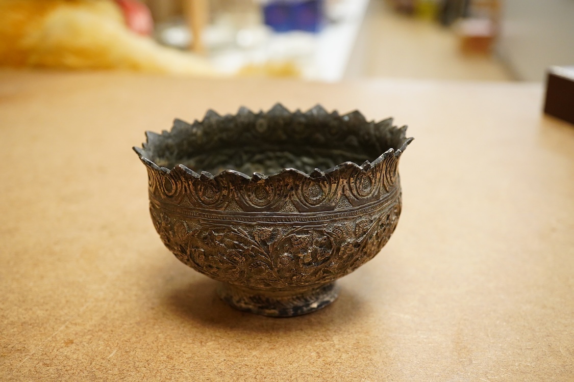 A 19th century Kashmiri base metal repousse bowl , with foliate border, diameter 10.8cm.